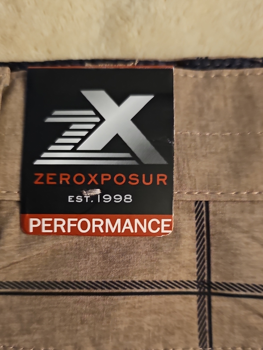 ZeroXposur Boys Plaid Performance Shorts in Tan and Black